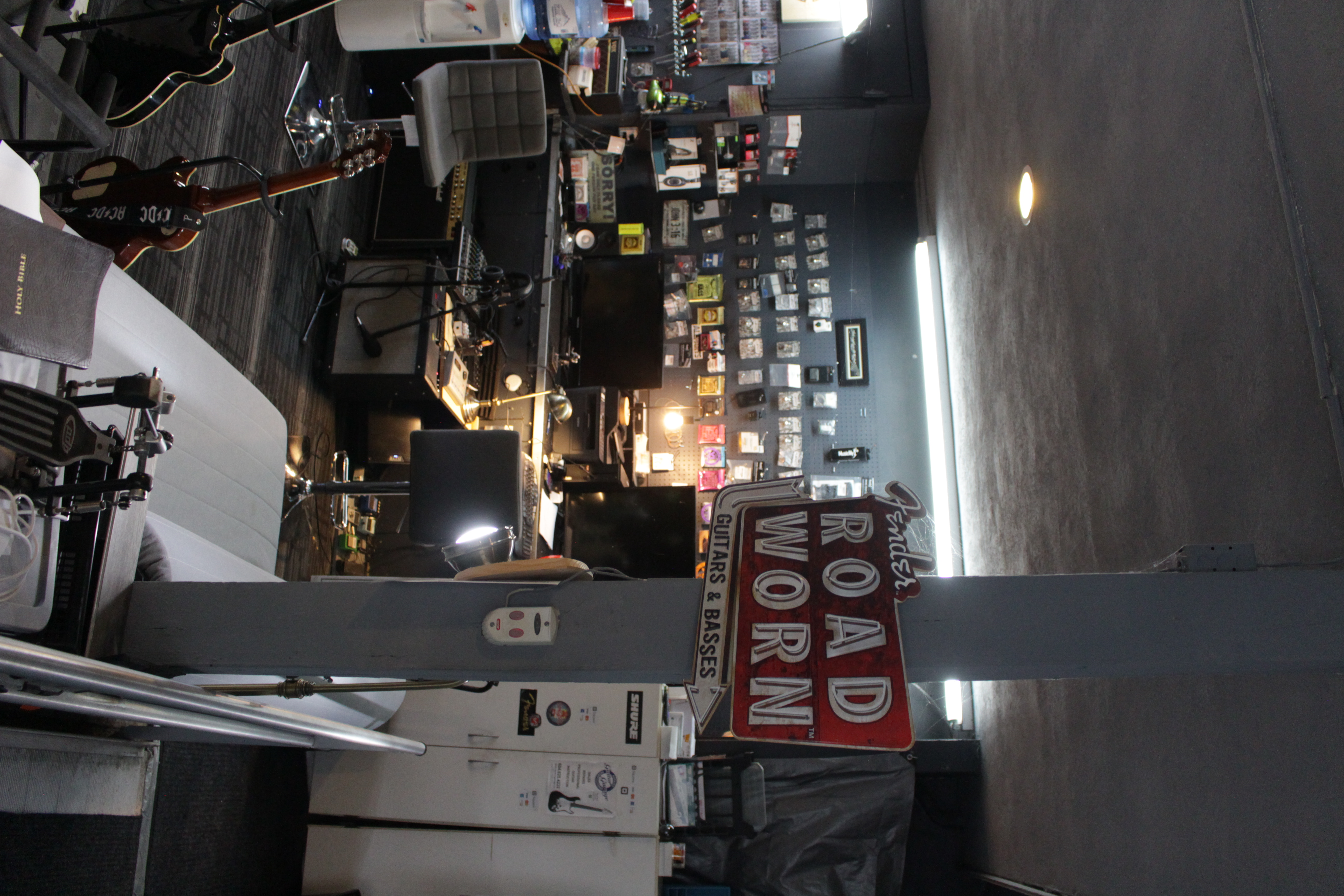 GuitarGarage workshop interior showing professional repair area with tools and workstations