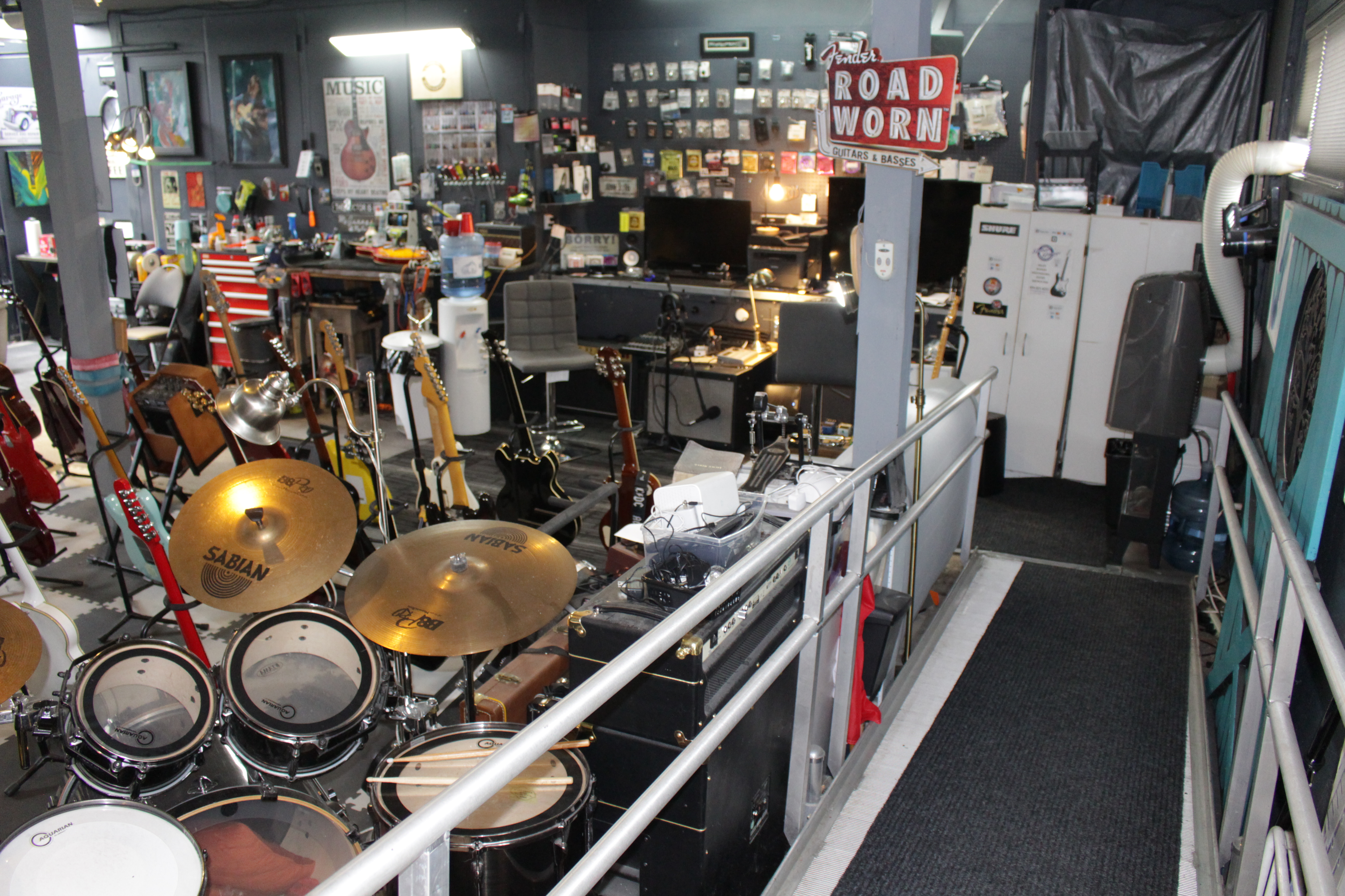 Wide view of GuitarGarage workshop featuring organized repair and maintenance areas