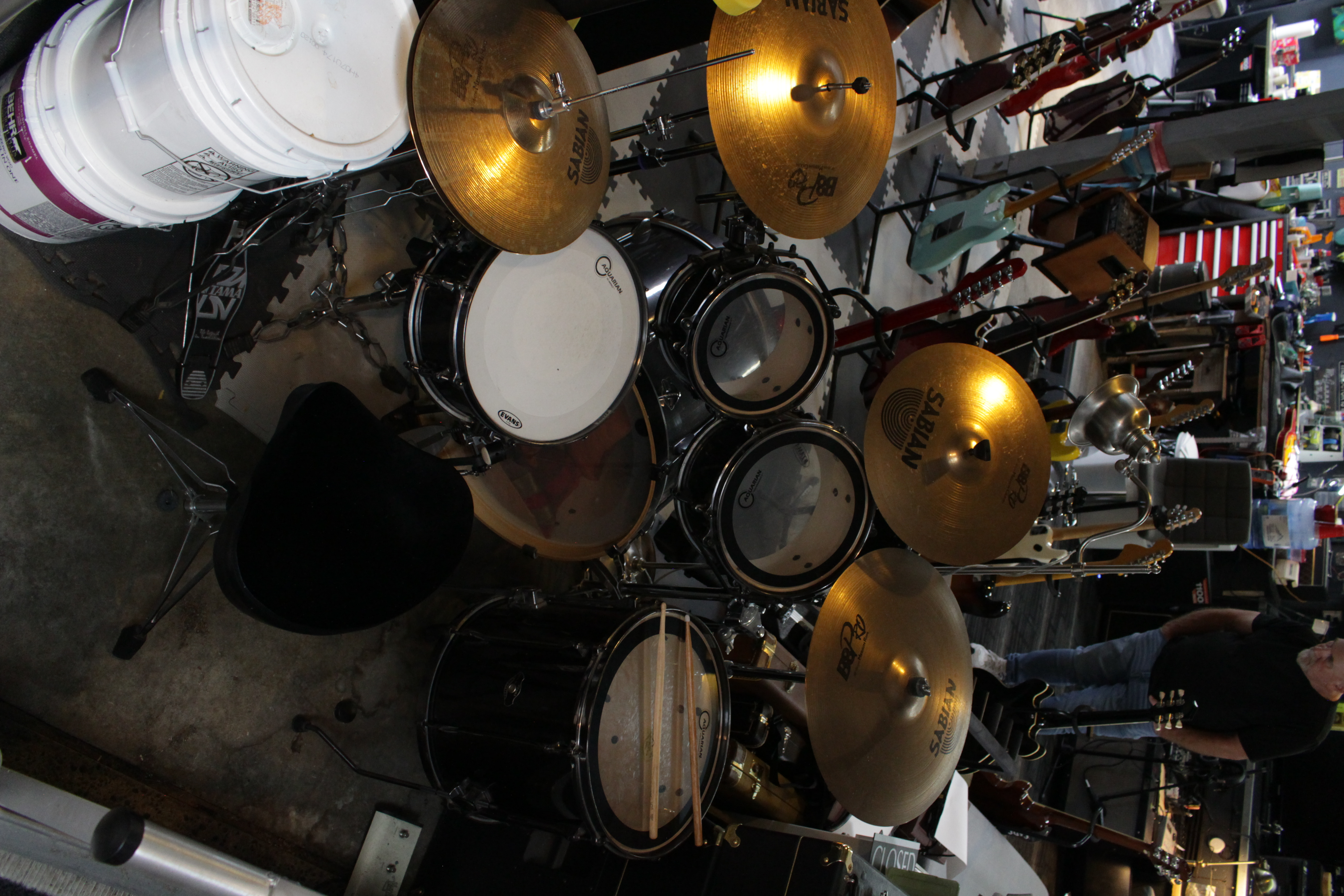 Professional drum kit and percussion setup in GuitarGarage studio