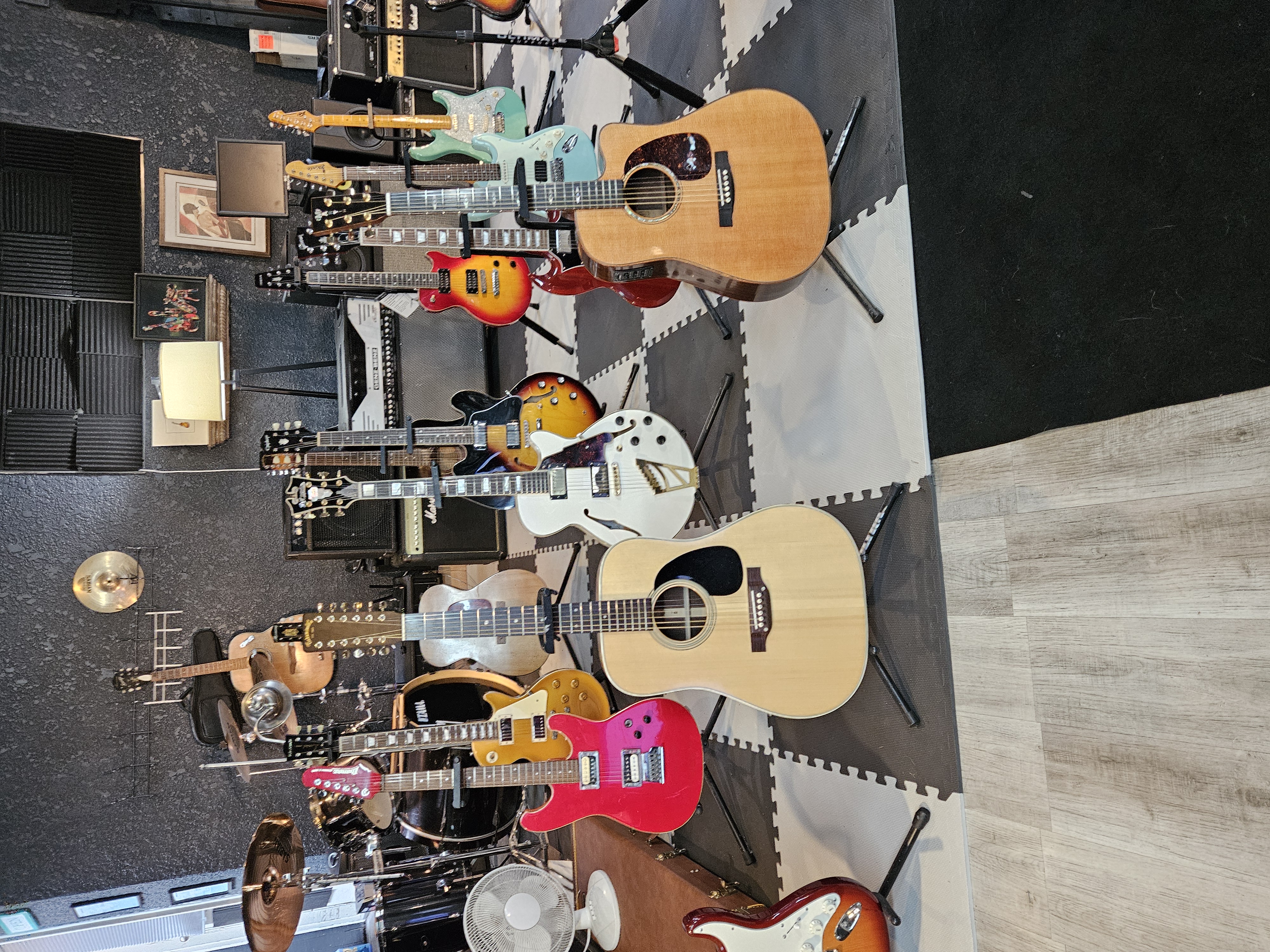 Collection of premium guitars for sale including acoustic and electric models displayed in GuitarGarage showroom
