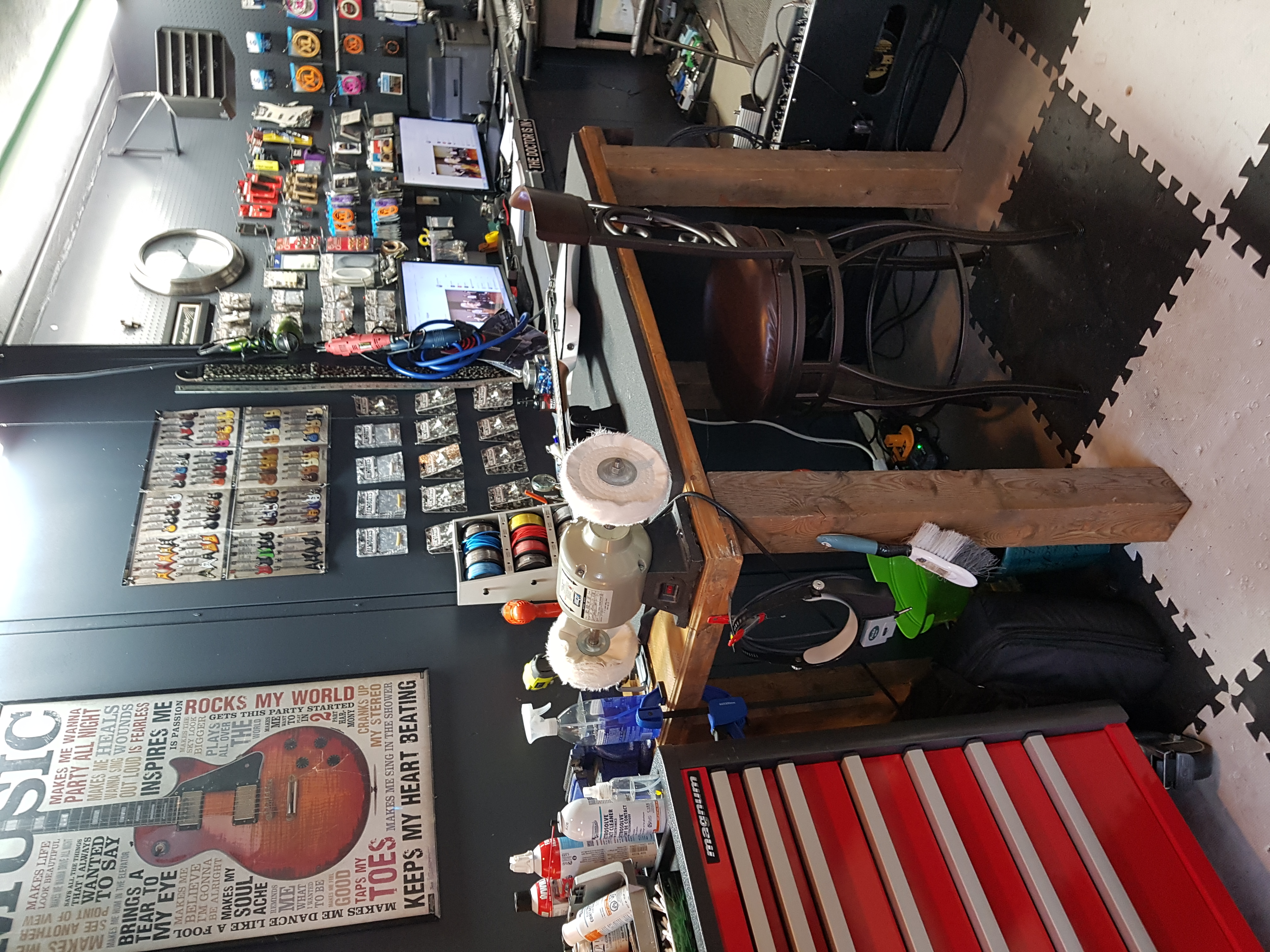 Professional guitar setup workstation with organized tools and equipment